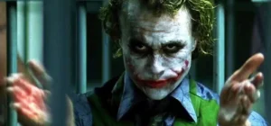 Man with green hair smirking