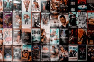A collage of various VHS covers, showcasing iconic movies like "Braveheart," "Jurassic Park," and "The Ring," with vibrant artwork.
